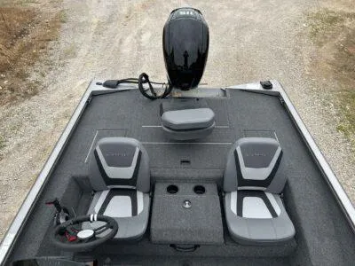 Slide: The Image of 2025 Lowe Stinger 195 Crappie boat interior with dual seats and motor. - 4