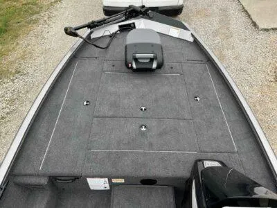 Slide: The Image of 2025 Lowe Stinger 195 Crappie boat deck with storage compartments and trolling motor. - 5