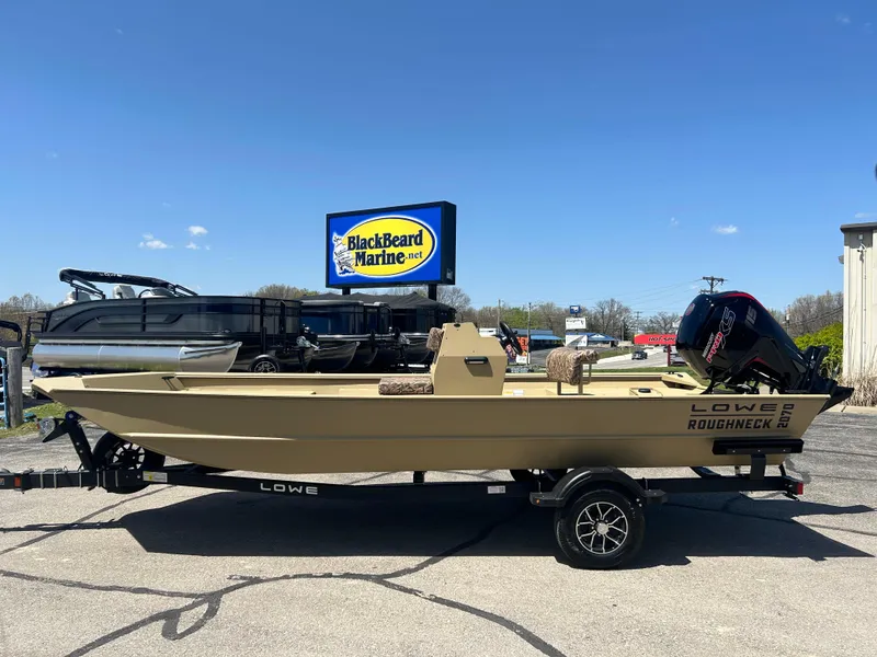 Slide: The Image of 2025 Lowe Roughneck 2070 CC boat on trailer at BlackBeard Marine dealership. - 2