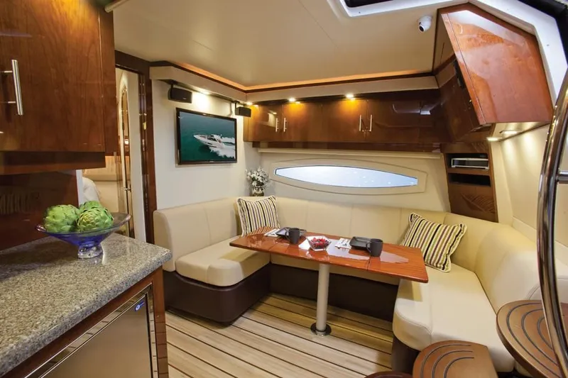 Slide: The Image of Luxurious interior of a 2014 Regal 42 Sport Coupe yacht with modern amenities. - 24