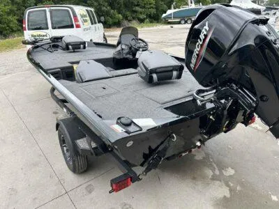 Slide: The Image of 2025 Lowe Stinger 175 Crappie boat with Mercury engine, parked on a trailer. - 4