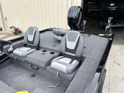 Slide: The Image of 2025 Lowe Stinger 175 Crappie boat interior with dual seats and motor. - 8