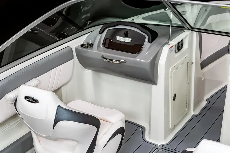 Slide: The Image of 2026 Chaparral 21 SSi boat interior with modern dashboard and seating. - 11
