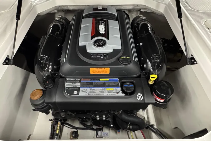 Slide: The Image of Engine compartment of 2026 Chaparral 21 SSi boat, featuring a Mercury 250 engine. - 21