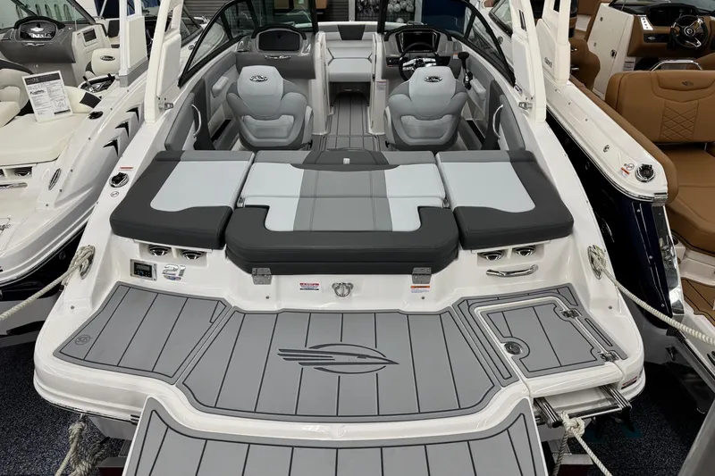 Slide: The Image of 2026 Chaparral 21 SSi boat interior with gray seating and sleek design. - 23