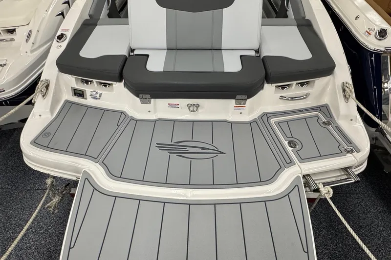 Slide: The Image of 2026 Chaparral 21 SSi boat with sleek gray seating and deck design. - 24