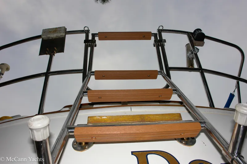 Slide: The Image of Ladder on 1984 Sabre 32 Aft-Cabin yacht, viewed from below, with metal railings. - 16