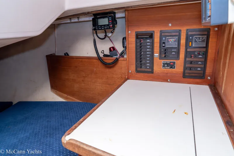 Slide: The Image of 1984 Sabre 32 Aft-Cabin interior with control panels and radio equipment. - 30