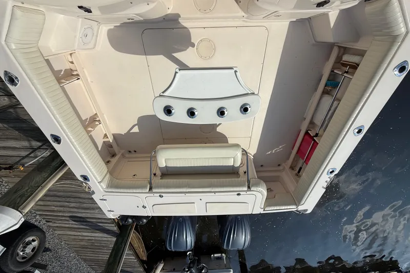 Slide: The Image of 2007 Grady-White Express 330 boat interior with seating and storage compartments. - 12