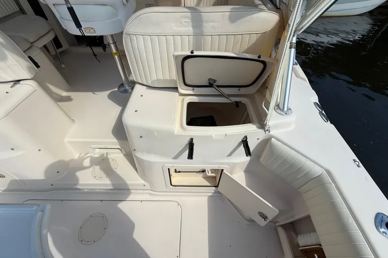 Slide: The Image of 2007 Grady-White Express 330 boat interior with open storage compartments. - 14