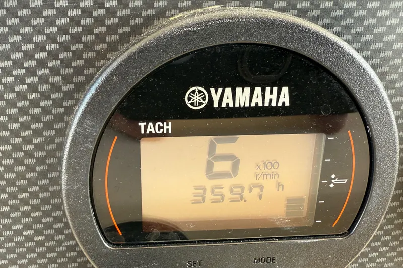 Slide: The Image of Yamaha tachometer displaying 6 x 100 RPM and 359.7 hours on Grady-White Express 330, 2007. - 18