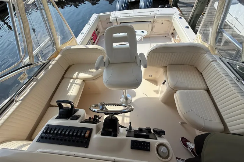 Slide: The Image of 2007 Grady-White Express 330 boat interior with helm and seating area. - 20