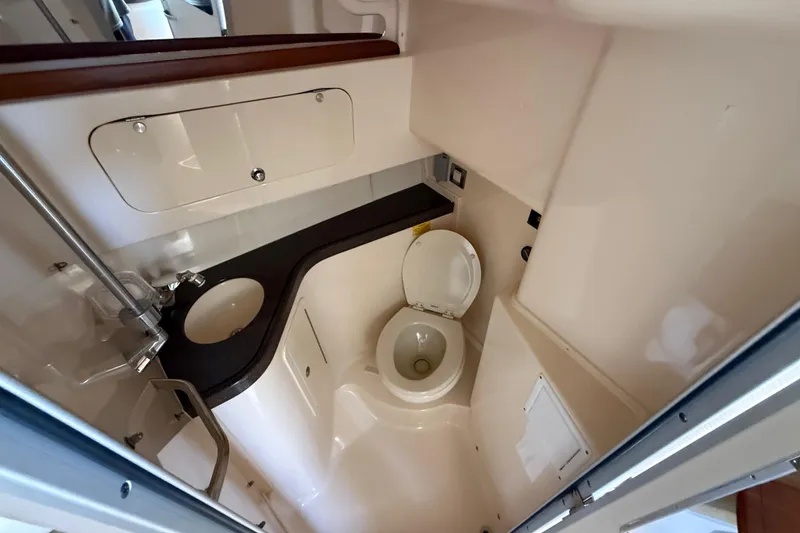 Slide: The Image of 2007 Grady-White Express 330 boat bathroom with sink and toilet. - 25