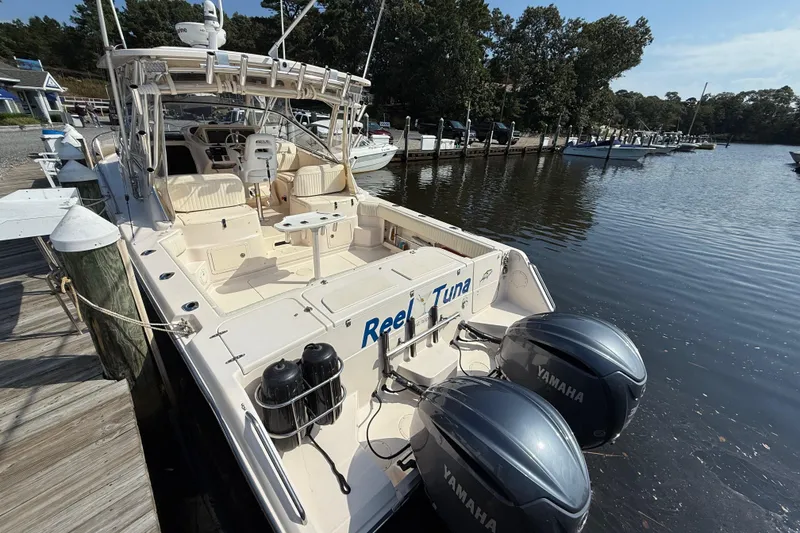 Slide: The Image of 2007 Grady-White Express 330 boat docked with twin Yamaha engines. - 4