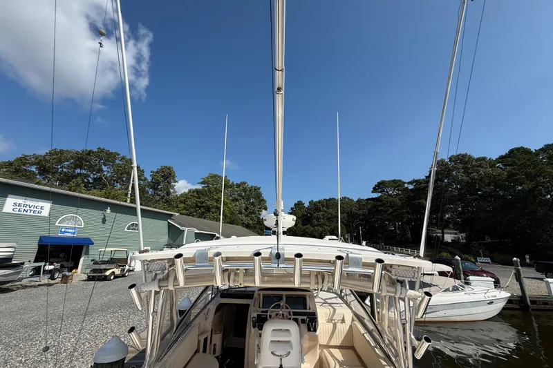 Slide: The Image of 2007 Grady-White Express 330 boat docked near service center under clear blue sky. - 8