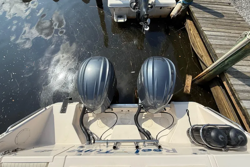 Slide: The Image of 2007 Grady-White Express 330 with dual outboard engines docked at marina. - 9