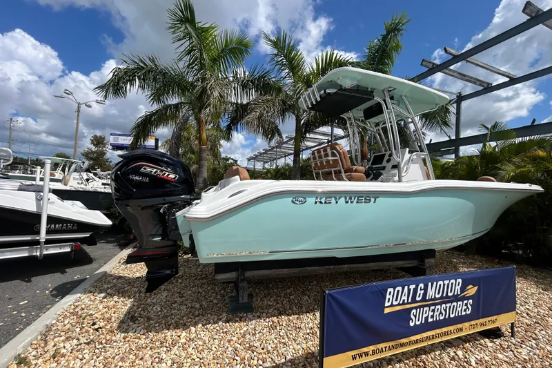 Slide: The Image of 2026 Key West 239 FS boat displayed at dealership with Yamaha engine. - 3