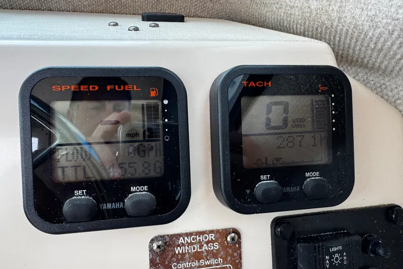 Slide: The Image of Dashboard of a 2007 Parker 2320 SL Sport Cabin boat with Yamaha gauges. - 10