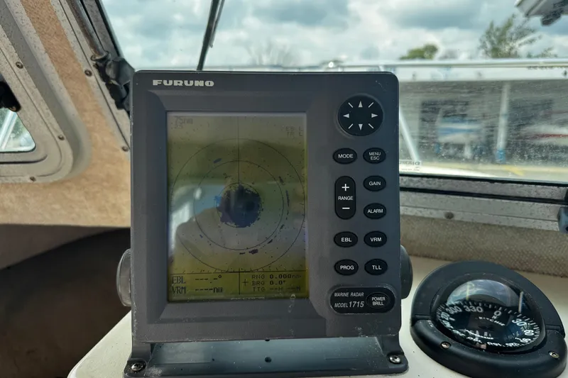 Slide: The Image of Furuno radar display and compass inside 2007 Parker 2320 SL Sport Cabin boat. - 14
