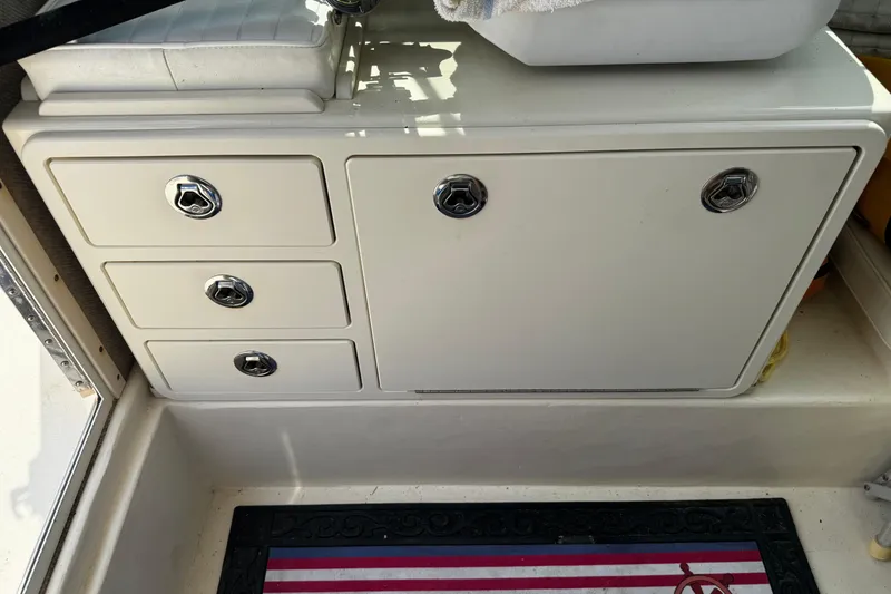 Slide: The Image of 2007 Parker 2320 SL Sport Cabin interior storage with drawers and cabinet. - 16