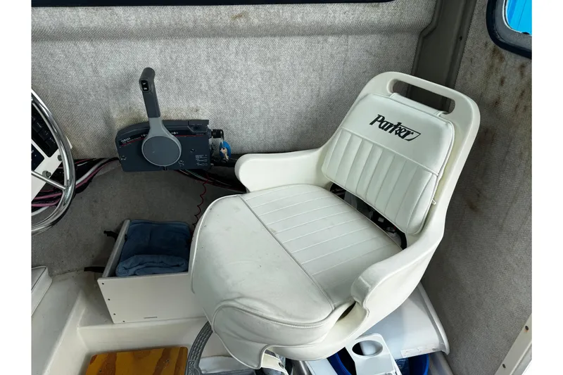 Slide: The Image of Captain's chair in 2007 Parker 2320 SL Sport Cabin boat interior. - 22