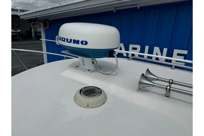 Slide: The Image of 2007 Parker 2320 SL Sport Cabin with Furuno radar and marine horns on deck. - 23