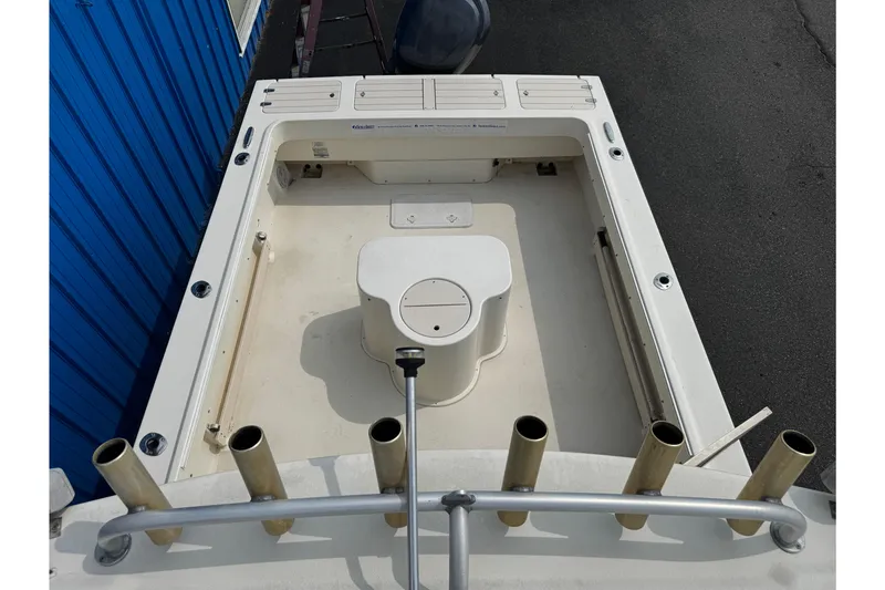 Slide: The Image of 2007 Parker 2320 SL Sport Cabin boat deck with rod holders and storage compartments. - 25