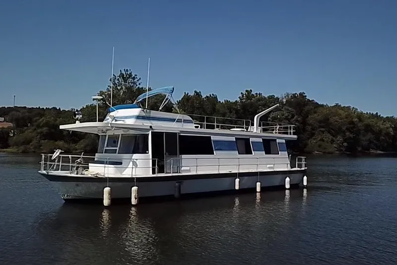 Slide: The Image of 1977 Pluckebaum Baymaster 52 X 17 Walkaround Sport Cruiser on calm water. - 37