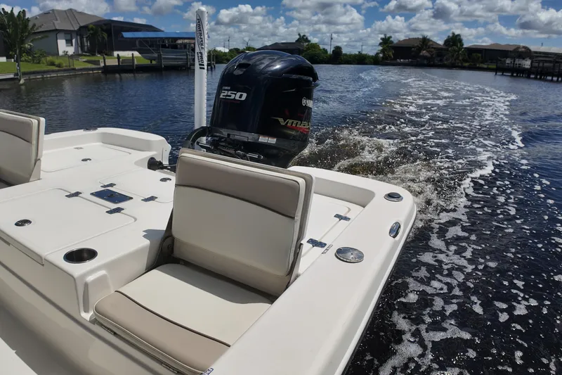 Slide: The Image of 2017 NauticStar 244 XTS boat cruising on a sunny day with Yamaha 250 engine. - 11