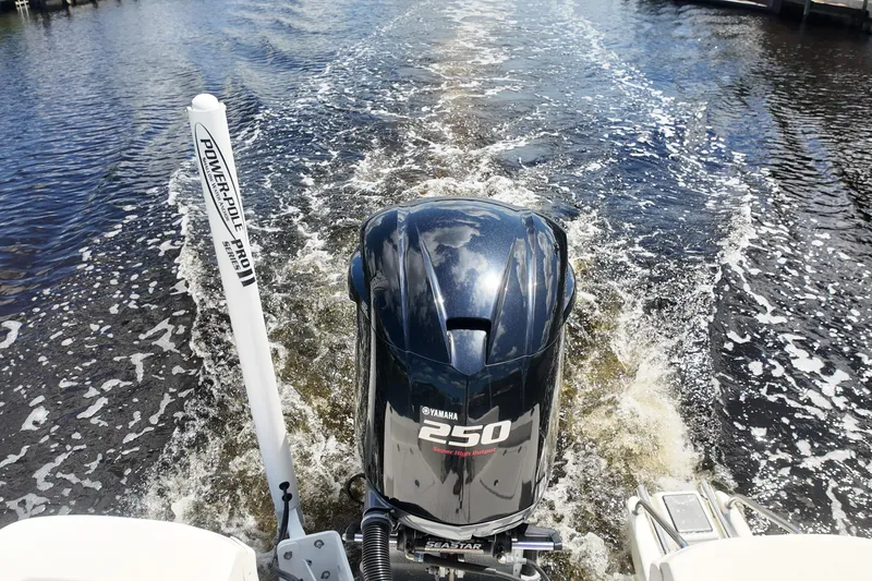 Slide: The Image of 2017 NauticStar 244 XTS with Yamaha 250 engine cruising on water. - 12