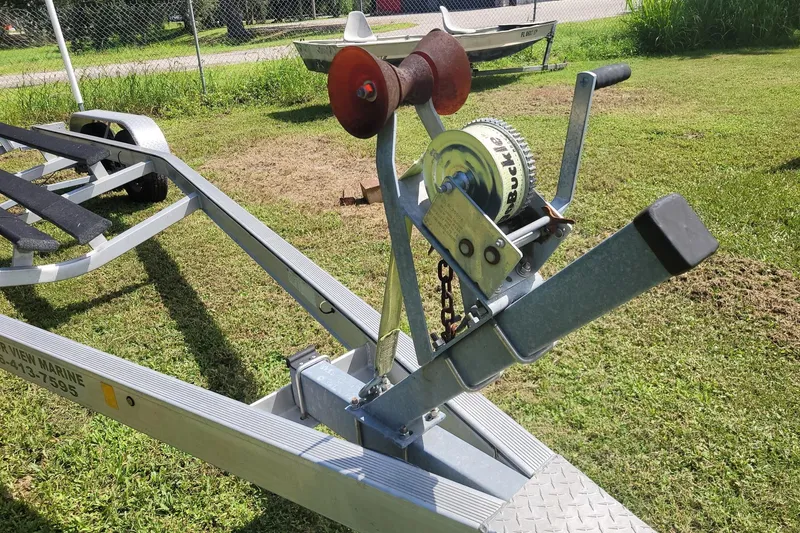 Slide: The Image of Boat trailer winch for 2017 NauticStar 244 XTS on grassy area. - 26