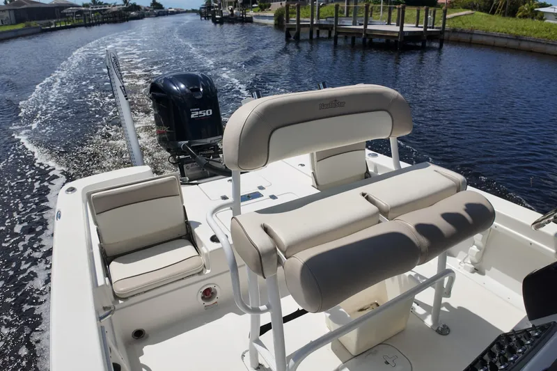 Slide: The Image of 2017 NauticStar 244 XTS boat with Yamaha 250 engine on a sunny canal. - 8