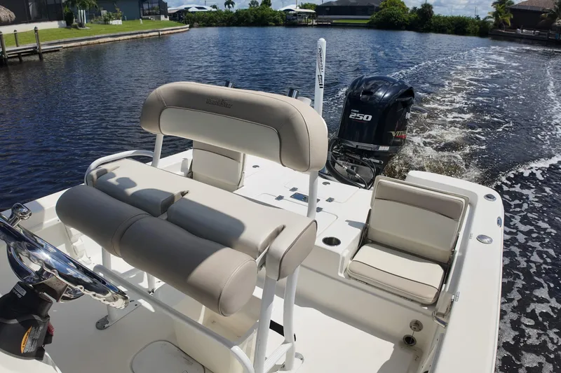 Slide: The Image of 2017 NauticStar 244 XTS boat with Yamaha 250 engine on a calm waterway. - 9