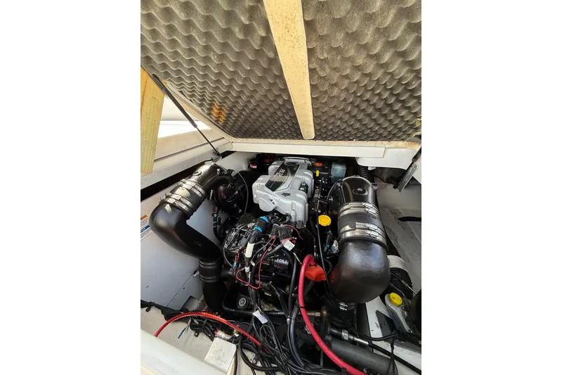 Slide: The Image of Engine compartment of a 2016 Sea Ray 270 Sundeck boat, showcasing detailed components. - 23