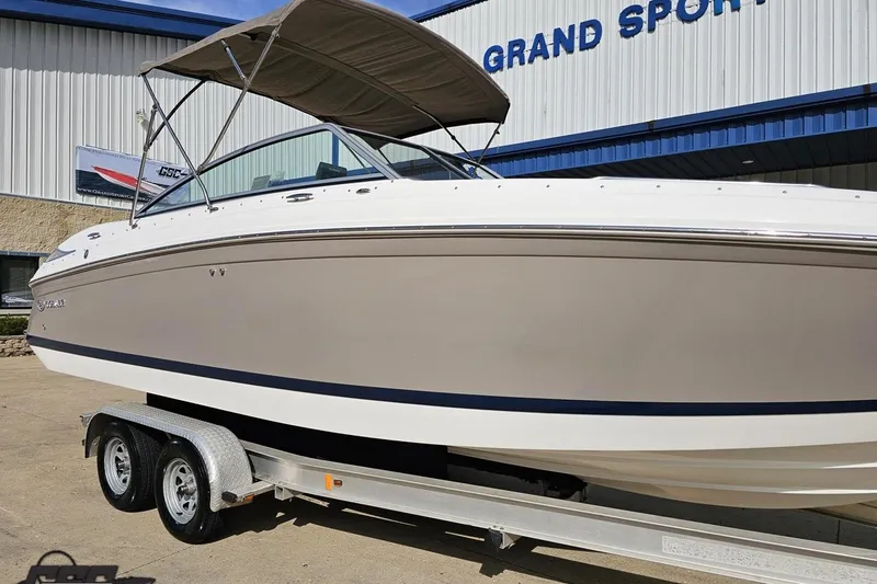 Slide: The Image of 2007 Cobalt 252 boat on trailer outside Grand Sport Center. - 11