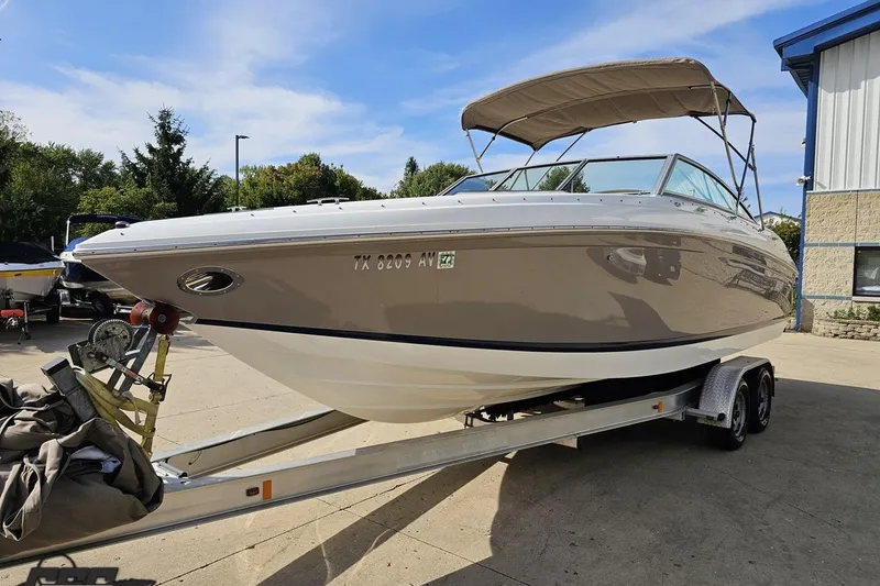 Slide: The Image of 2007 Cobalt 252 boat on trailer, parked outdoors under clear sky. - 17