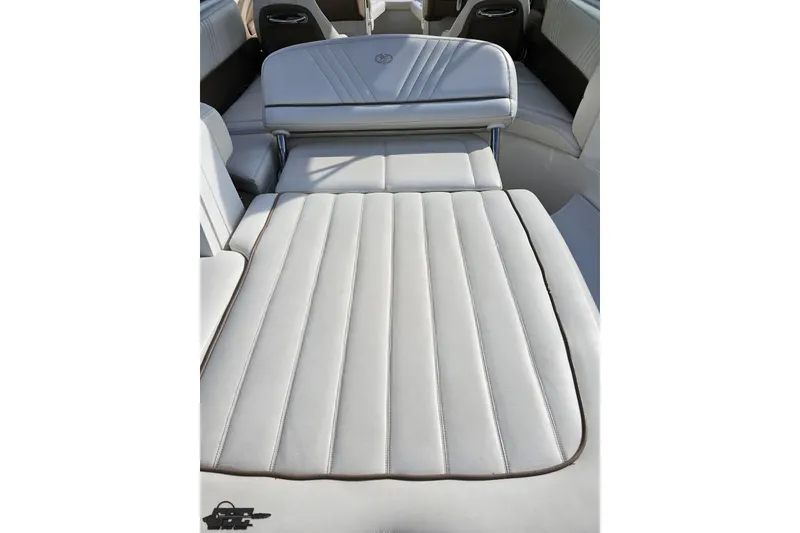 Slide: The Image of 2007 Cobalt 252 boat interior with white cushioned seating. - 39