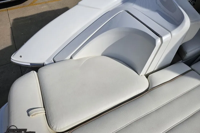 Slide: The Image of 2007 Cobalt 252 boat interior with white cushioned seating. - 41