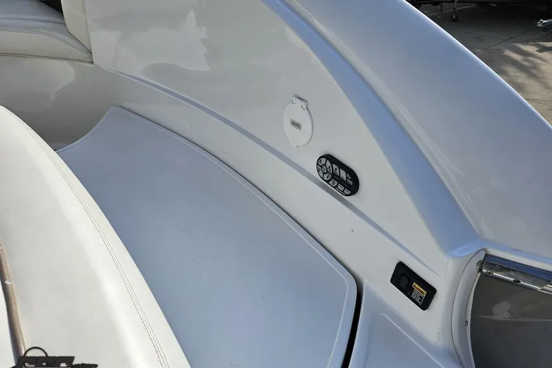 Slide: The Image of 2007 Cobalt 252 boat interior with control panel and seating area. - 44