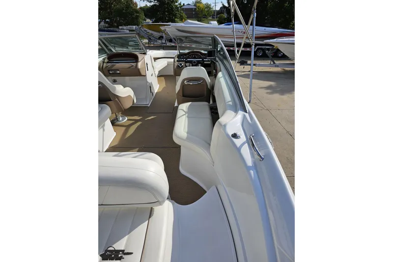 Slide: The Image of 2007 Cobalt 252 boat interior with white seating and dashboard view. - 45