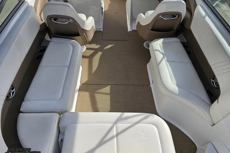 Slide: The Image of Interior of a 2007 Cobalt 252 boat with white seating and beige carpet. - 47
