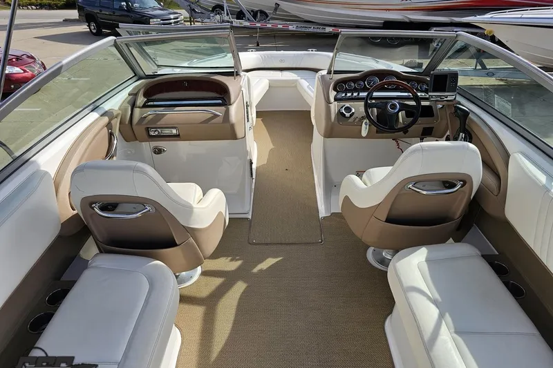 Slide: The Image of Interior of a 2007 Cobalt 252 boat with beige and white seating. - 49