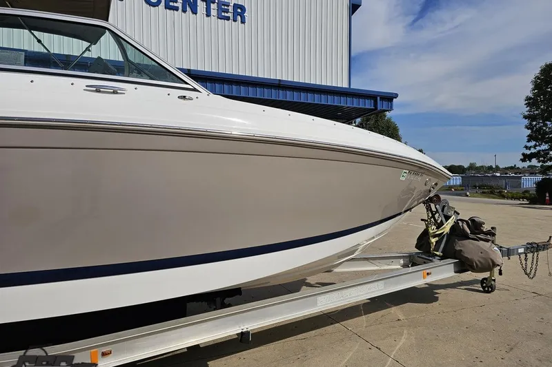 Slide: The Image of 2007 Cobalt 252 boat on trailer outside marine center. - 5
