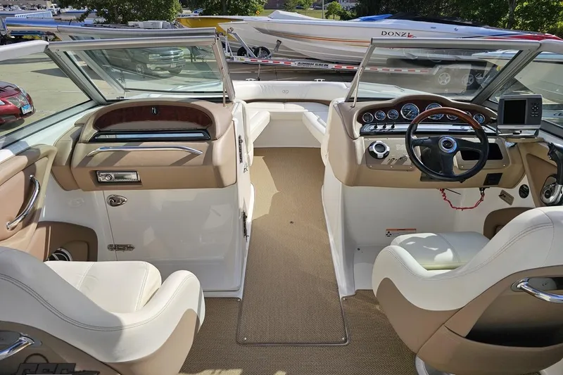 Slide: The Image of Interior of a 2007 Cobalt 252 boat with beige and white seating. - 50
