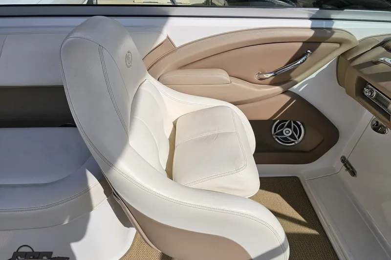 Slide: The Image of Interior of 2007 Cobalt 252 boat with white leather seating and beige accents. - 52