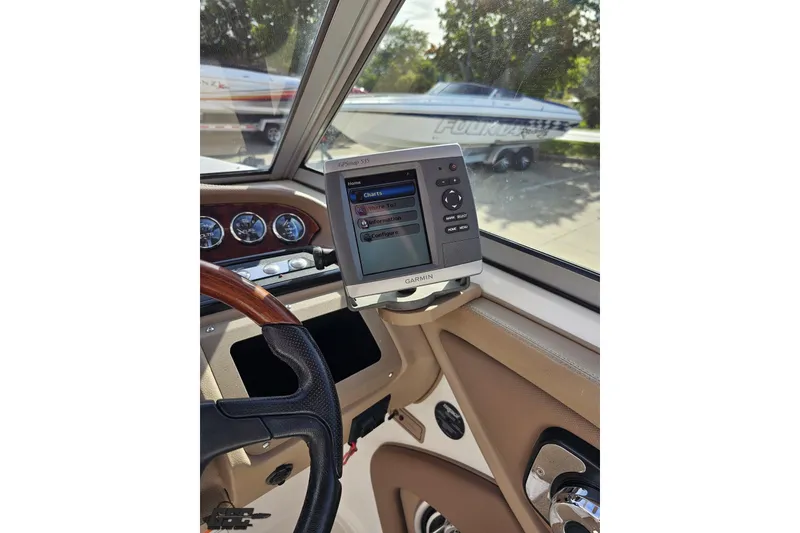 Slide: The Image of Interior of a 2007 Cobalt 252 boat with Garmin GPS and steering wheel. - 66
