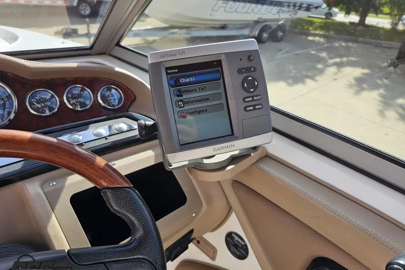 Slide: The Image of 2007 Cobalt 252 boat dashboard with Garmin GPSmap 535 navigation system. - 67