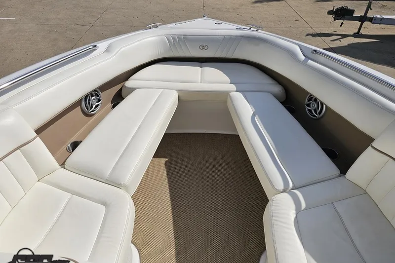 Slide: The Image of Luxurious seating area on a 2007 Cobalt 252 boat with white upholstery. - 71