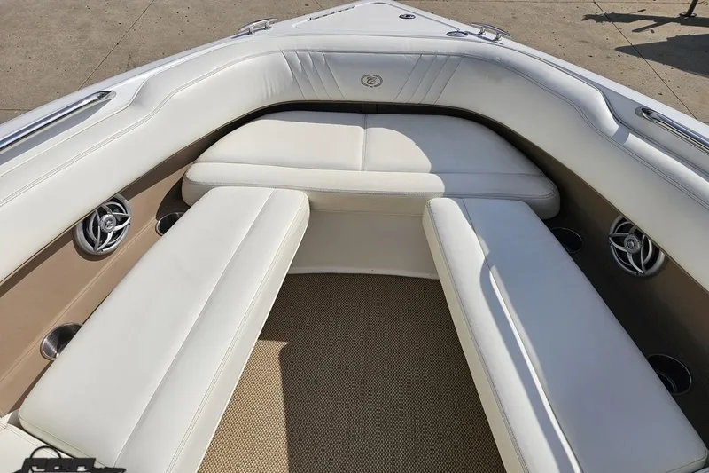 Slide: The Image of Interior of a 2007 Cobalt 252 boat with white cushioned seating. - 72