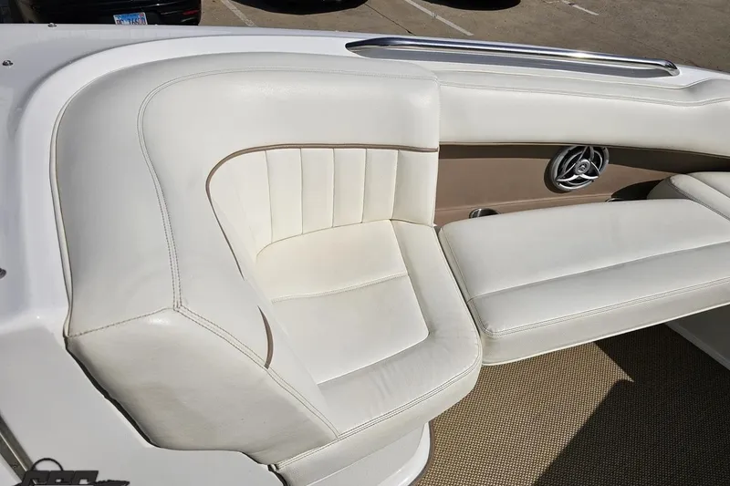 Slide: The Image of 2007 Cobalt 252 boat interior with white leather seating and speaker detail. - 75